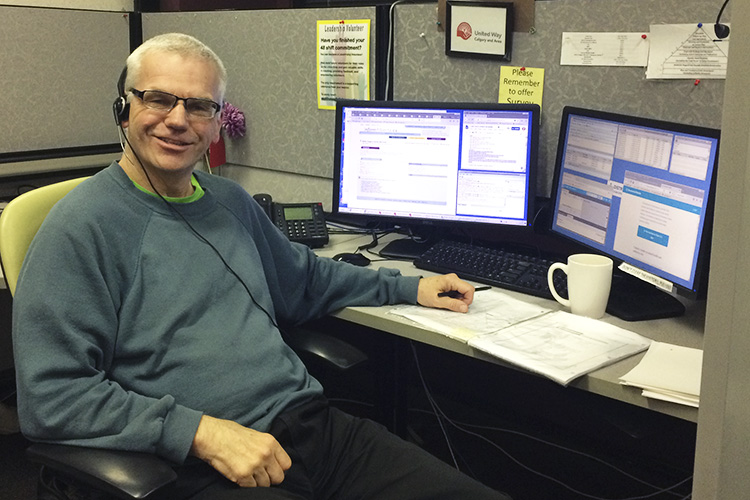 Peter Oxland at his work station at Distress Centre Calgary