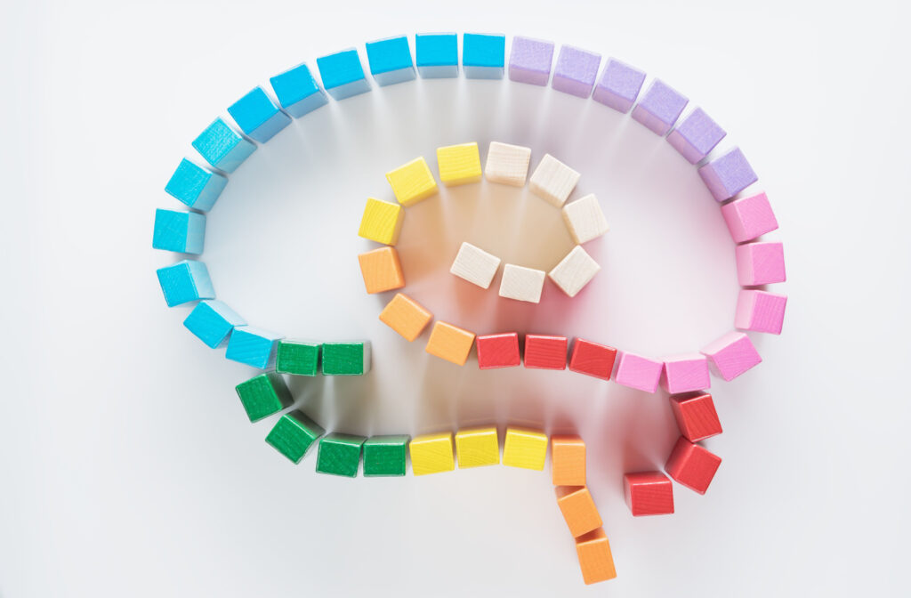 Rainbow coloured blocks designed in the formation of a human brain to show why mental health matters.